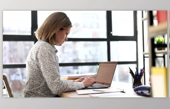 Download <span class='badge badge-warning'>Serious</span> Focused Business Woman Working on Laptop (Videohive 43647847)